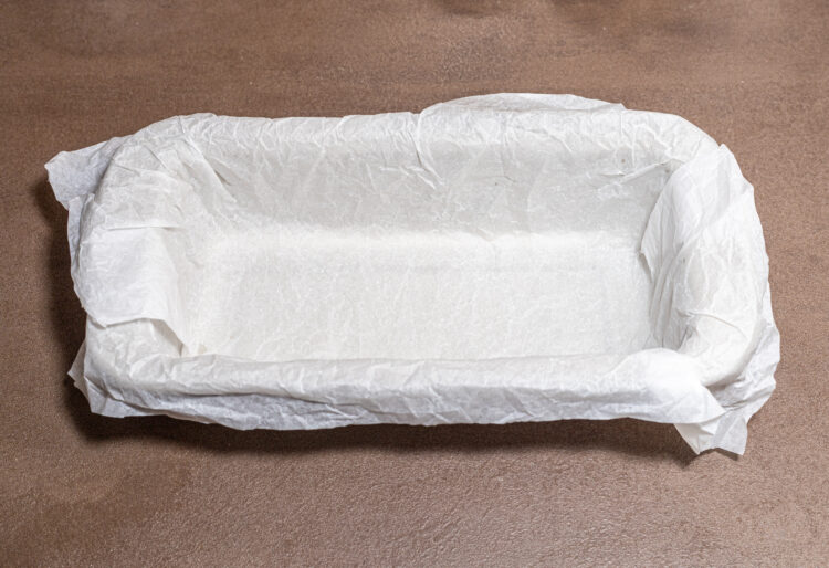 Baking dish lined with parchment paper.