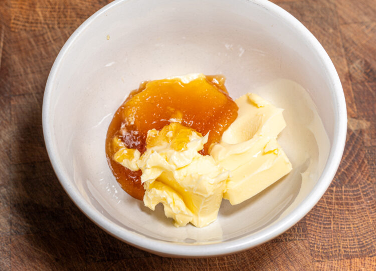 Butter and honey in a bowl.