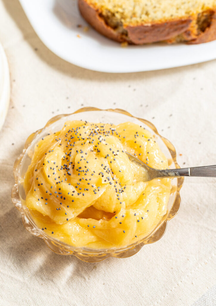 Honey butter with poppy seeds on top in a dish.
