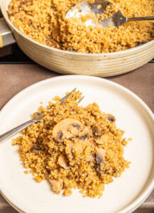 Mushroom quinoa with a fork.
