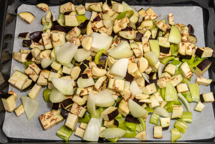 Chopped veggies on a baking tray.