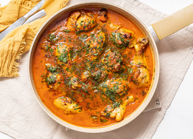 Chicken coconut curry on a skillet.