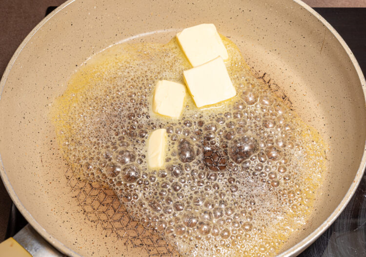 Melting butter in a skillet.