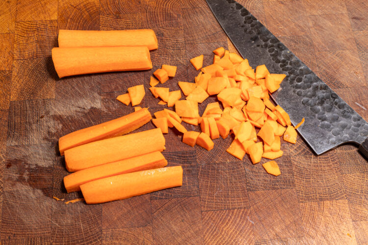 Chopping carrots.