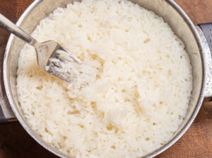 Fork inside a pot with rice.