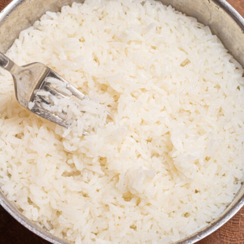 Fork inside a pot with rice.