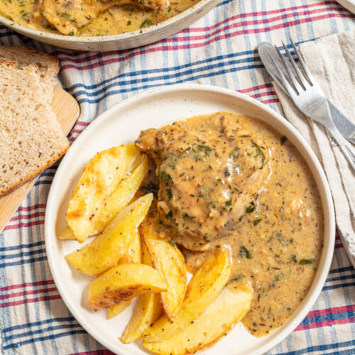 Plate with honey mustard chicken and roasted potatoes.